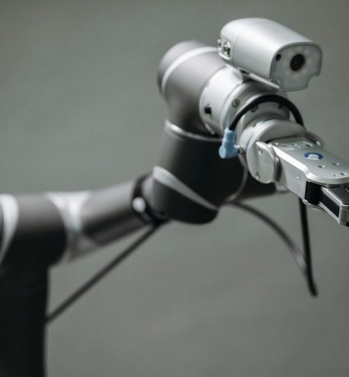 Close-up view of a robotic arm equipped with a video camera, showcasing modern technology.